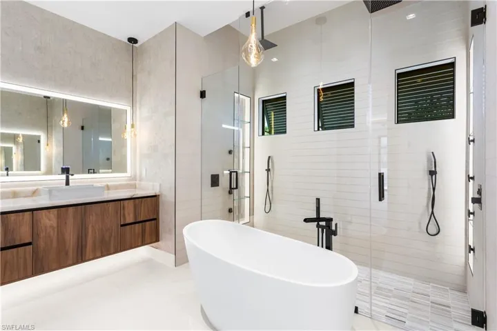 STANDALONE TUB & custom vanities w/ VESSEL SINKS, an indulgent SPA ATMOSPHERE