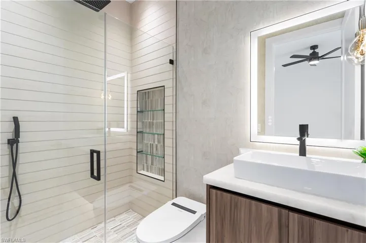 A second master bathroom enhances convenience and privacy, offering a luxurious space for guests or family members to enjoy.