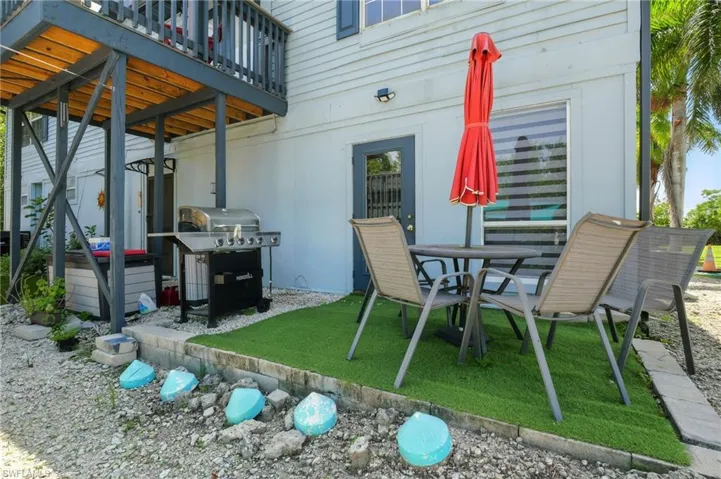 View of patio / terrace featuring area for grilling and outdoor dining area