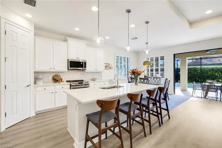 *Kitchen cabinets digitally painted white*