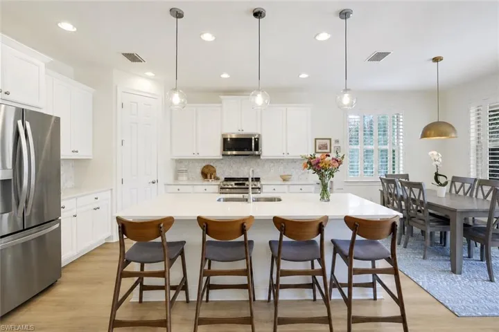*Kitchen cabinets digitally painted white*