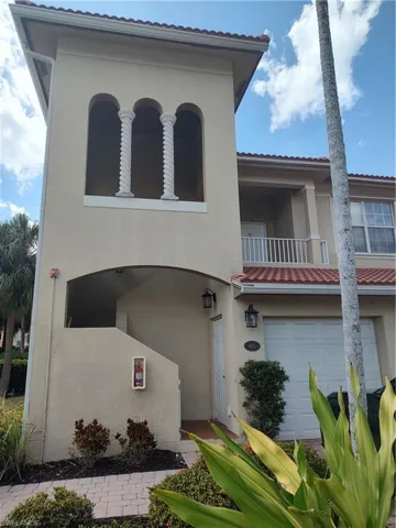 Mediterranean / spanish-style home with a balcony and stucco siding