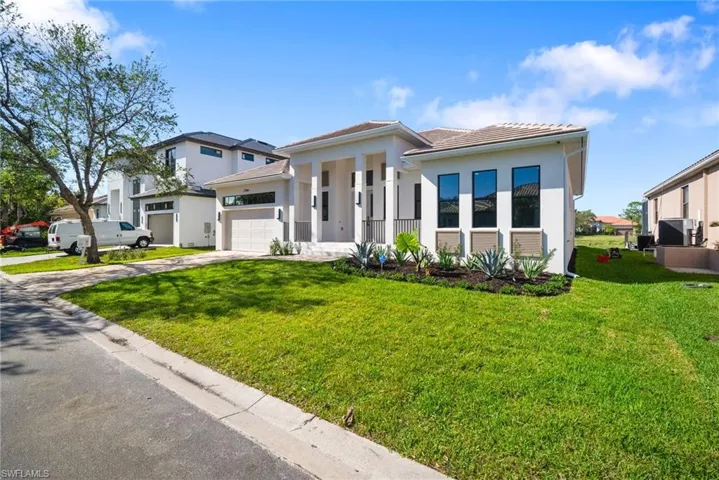 View of front of property with a front lawn