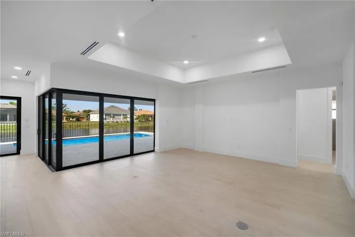 Unfurnished room with light hardwood / wood-style flooring