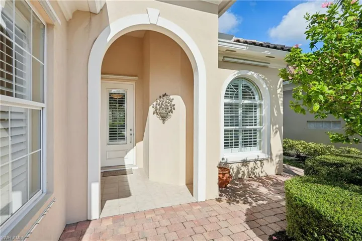 Property entrance with stucco siding