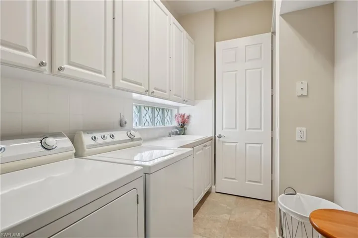 Laundry area with washer and dryer and cabinet space