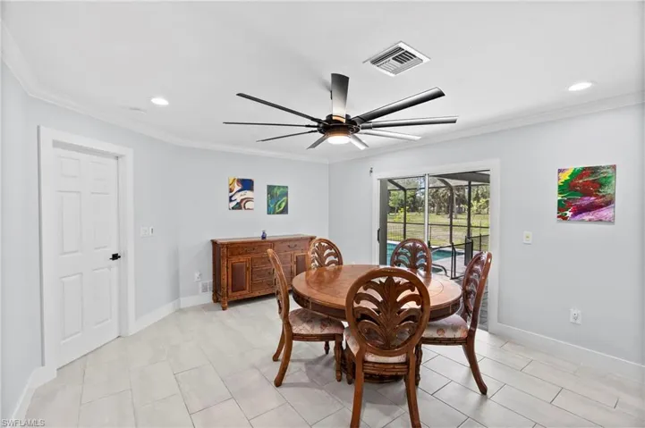 Dining area with light-toned rectangular tile flooring