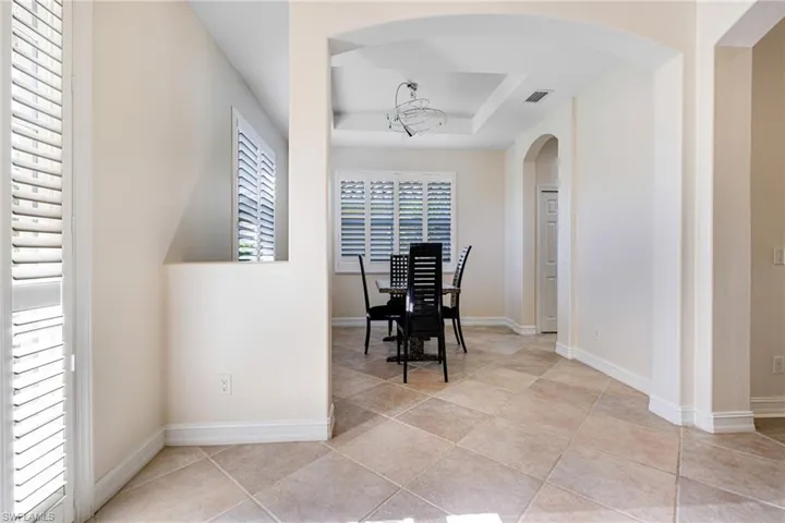 Formal dining area with tray ceiling