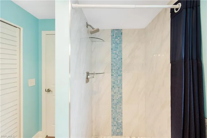 Bathroom with a shower with curtain