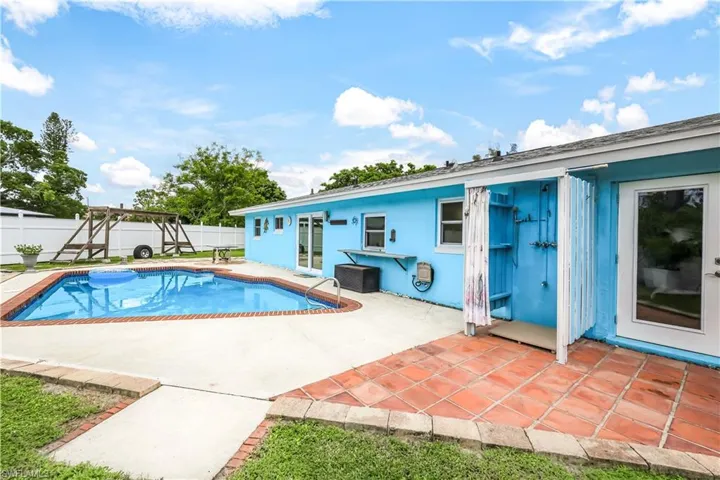 View of swimming pool with a patio