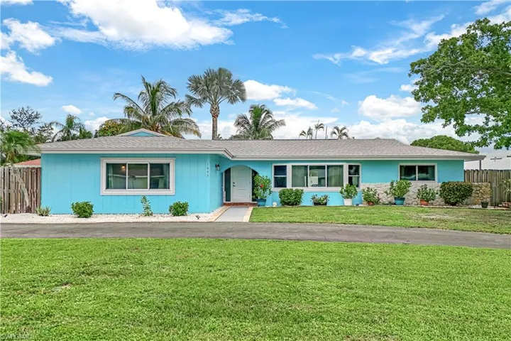 Single story home featuring a front yard