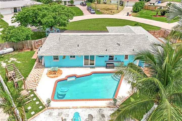 View of swimming pool featuring a patio and a yard