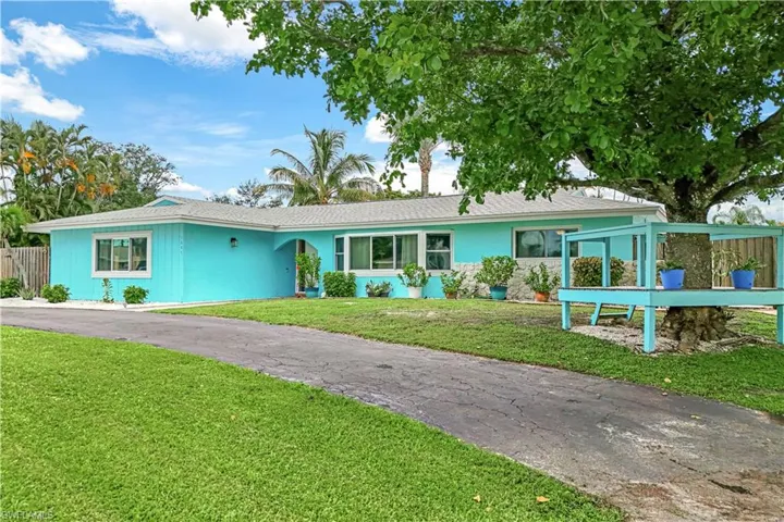 Single story home with a front yard