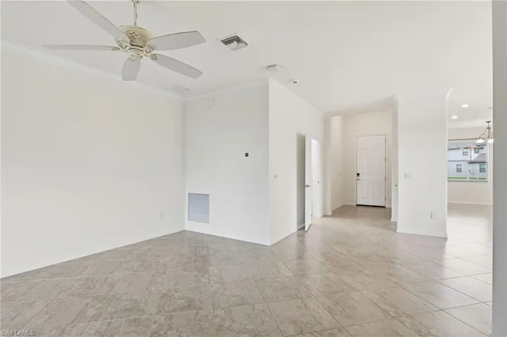 Spare room featuring ornamental molding, ceiling fan, and recessed lighting