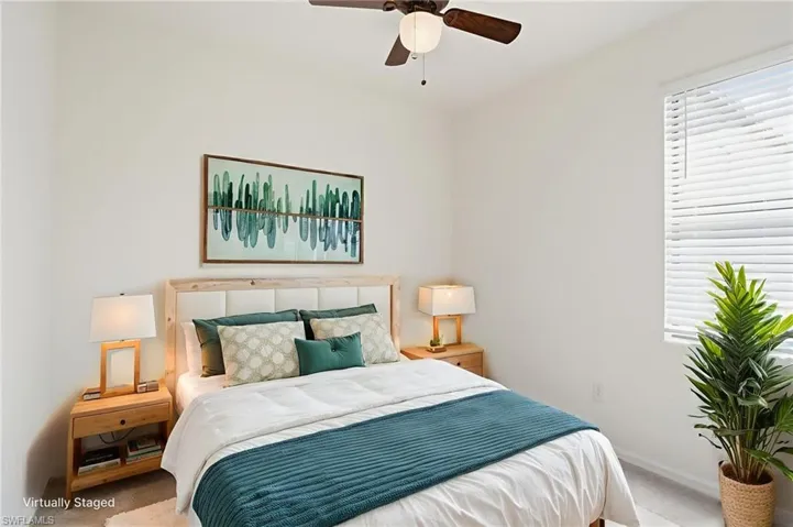 Bedroom featuring a ceiling fan and carpet flooring