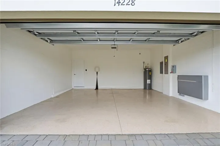Garage with water heater and solar power backup battery