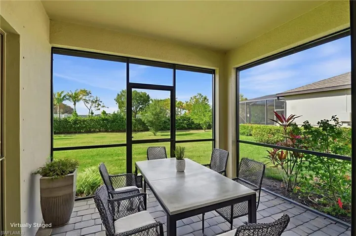 Sunroom / solarium featuring outdoor dining area