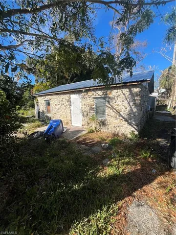 View of property exterior featuring stone siding