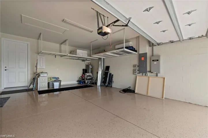Garage with electric panel, insulated doors with mini split a/c unit, 4 foot extension