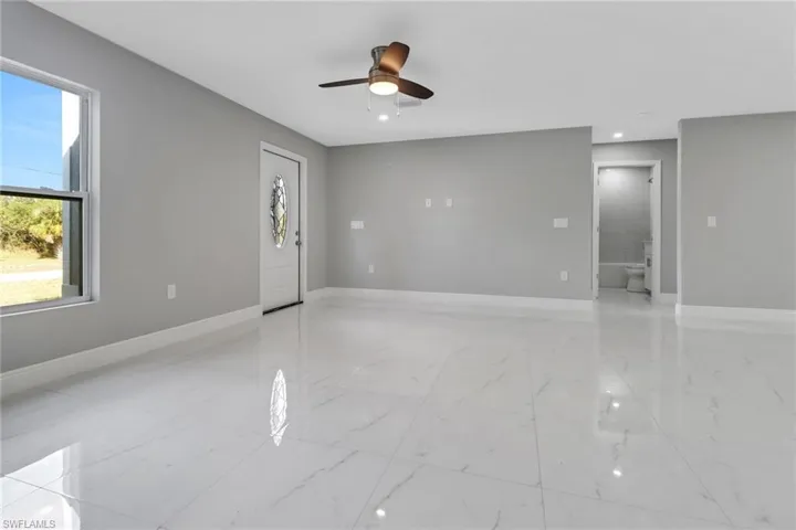 Spare room with ceiling fan