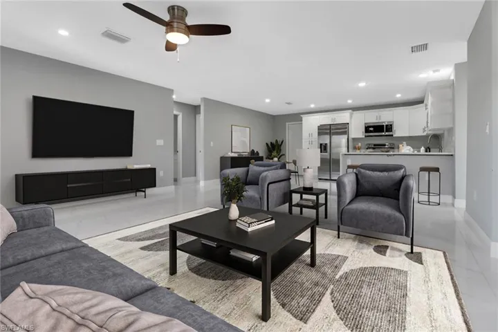 Living room with sink and ceiling fan