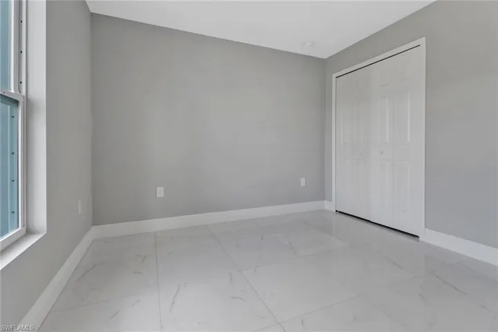 Unfurnished bedroom featuring a closet