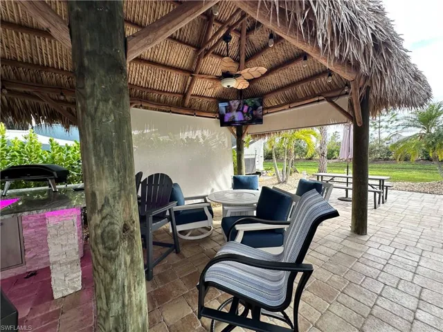View of patio / terrace with a gazebo and ceiling fan