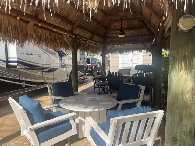 View of patio featuring a gazebo and ceiling fan