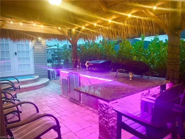 View of patio with an outdoor wet bar