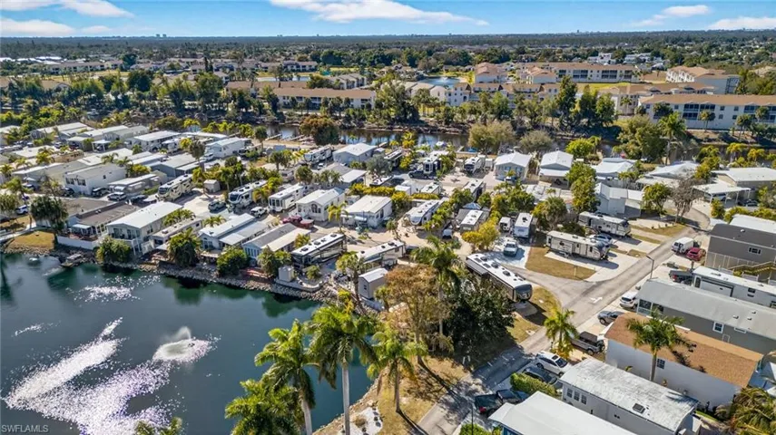 Aerial view of property's location featuring a large body of water
