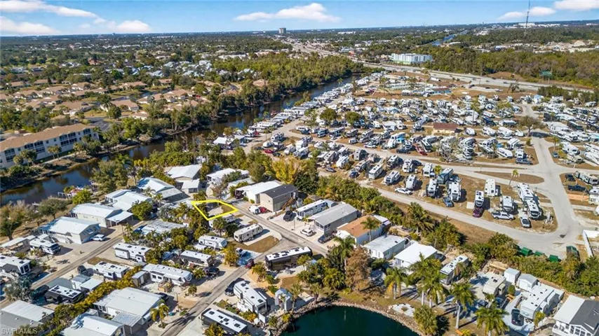 Aerial overview of property's location with nearby suburban area and a nearby body of water