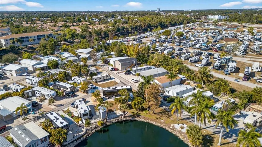 Aerial overview of property's location with a large body of water and nearby suburban area