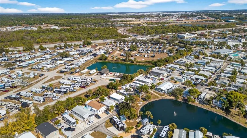 View of property location featuring nearby suburban area and a nearby body of water