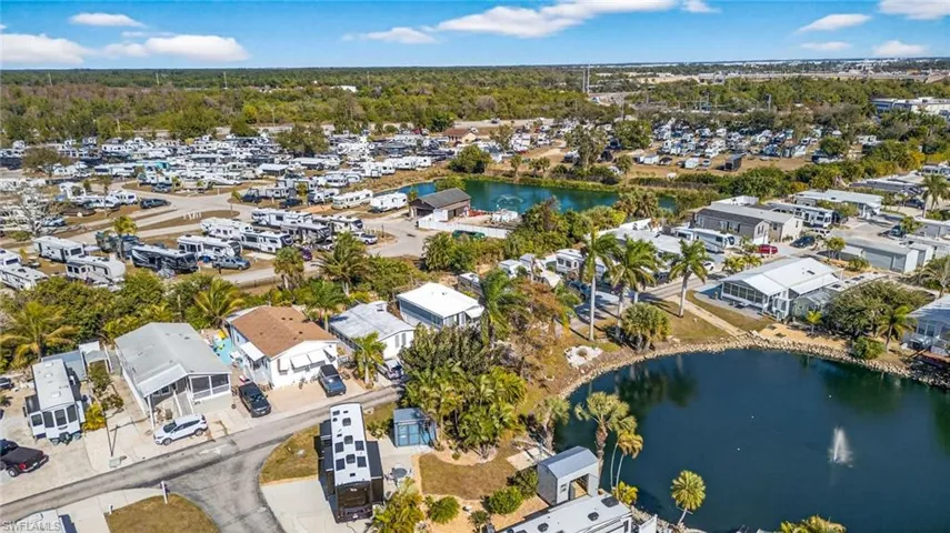 Aerial overview of property's location with a large body of water and nearby suburban area