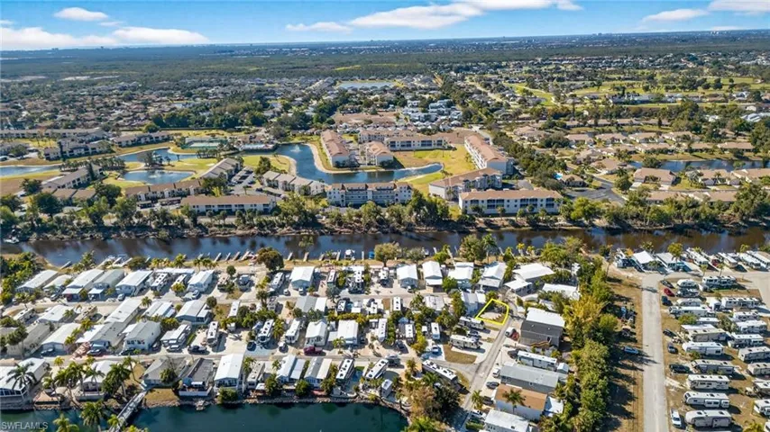 View of property location with a nearby body of water and nearby suburban area