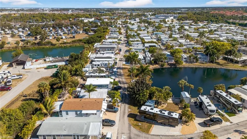 View of property location featuring a large body of water and nearby suburban area