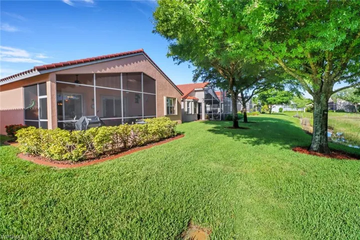 View of yard with a sunroom