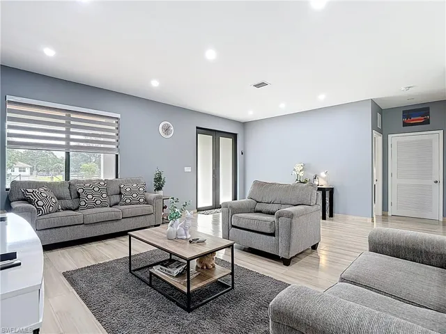 Living room featuring recessed lighting and light wood-style flooring