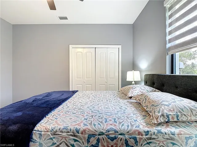 Bedroom with a closet and a ceiling fan
