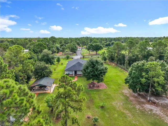 View from above of property with a forest