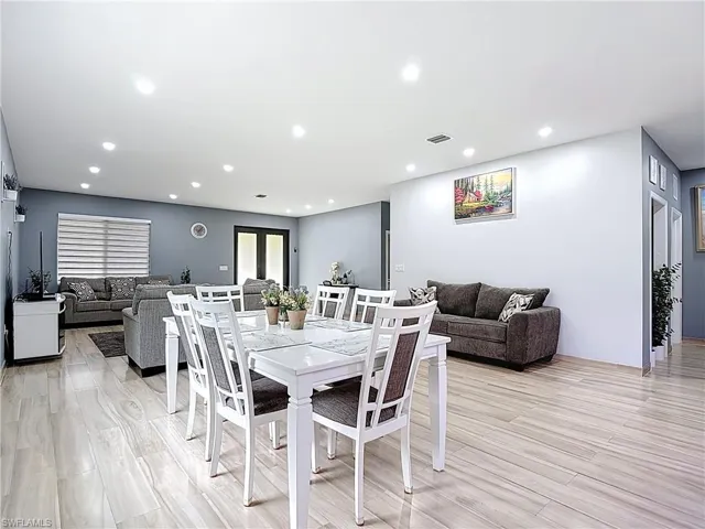 Dining space featuring light wood-style floors and recessed lighting