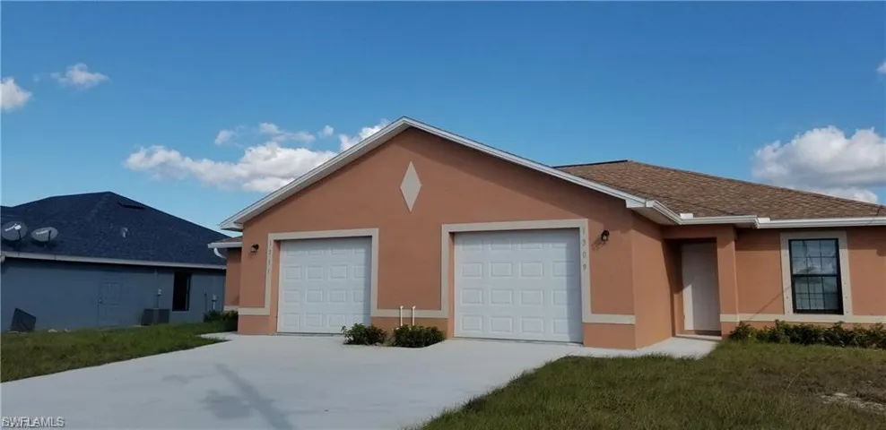 Single story home featuring stucco siding, an attached garage, concrete driveway, and a front lawn