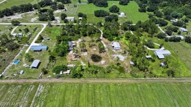 Birds eye view of property featuring a rural view