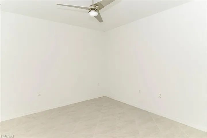 Spare room featuring ceiling fan