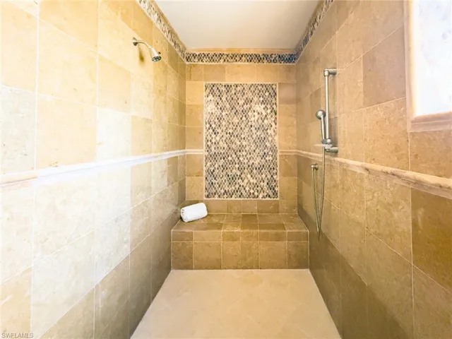Bathroom featuring tiled shower