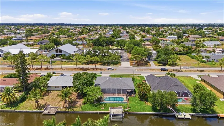 Waterfront property featuring a private boat dock and direct canal access