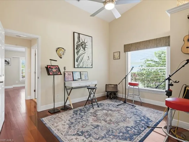 Office featuring wood finished floors and ceiling fan