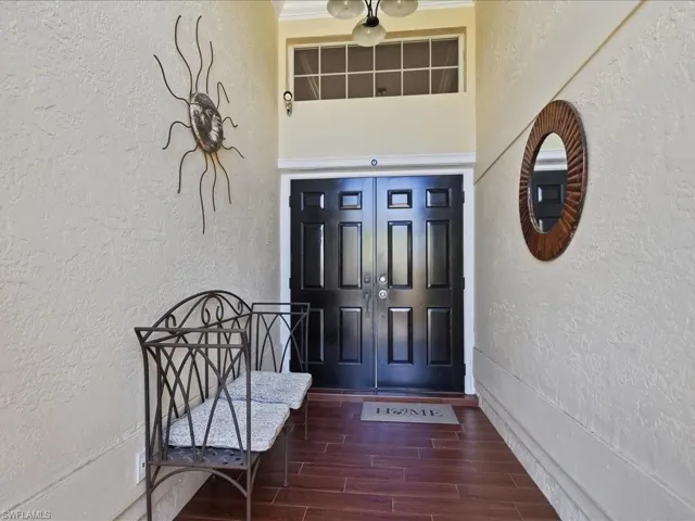 View of exterior entry with stucco siding