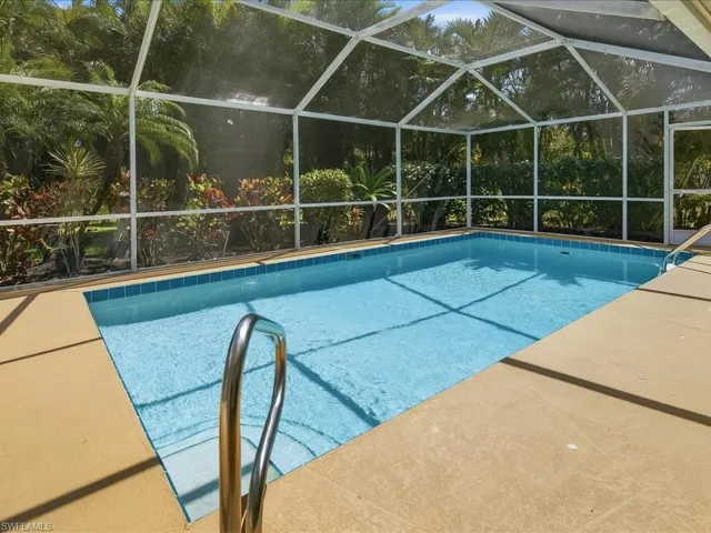 Outdoor pool with glass enclosure