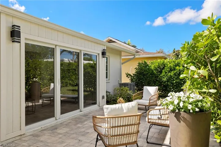 View of patio with an outdoor hangout area